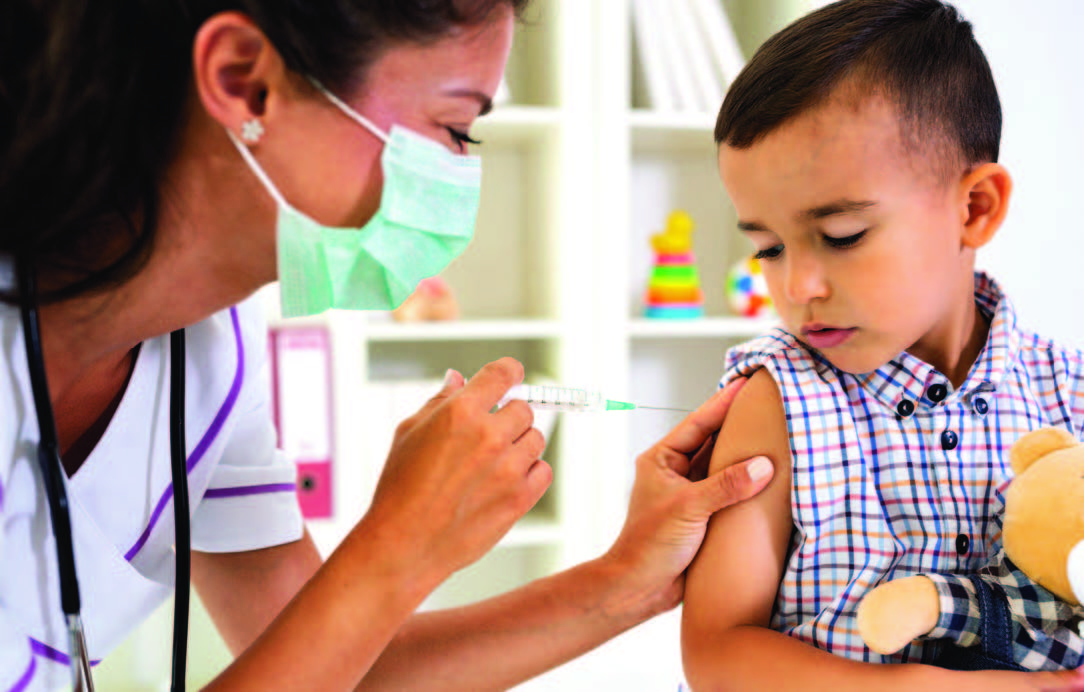 young boy getting an immunization