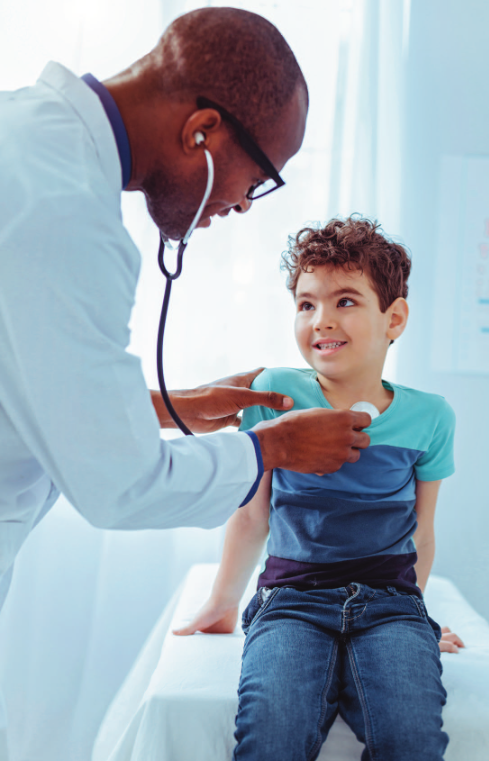 Child Health Insurance (Healthy) doctor checking young boys heart