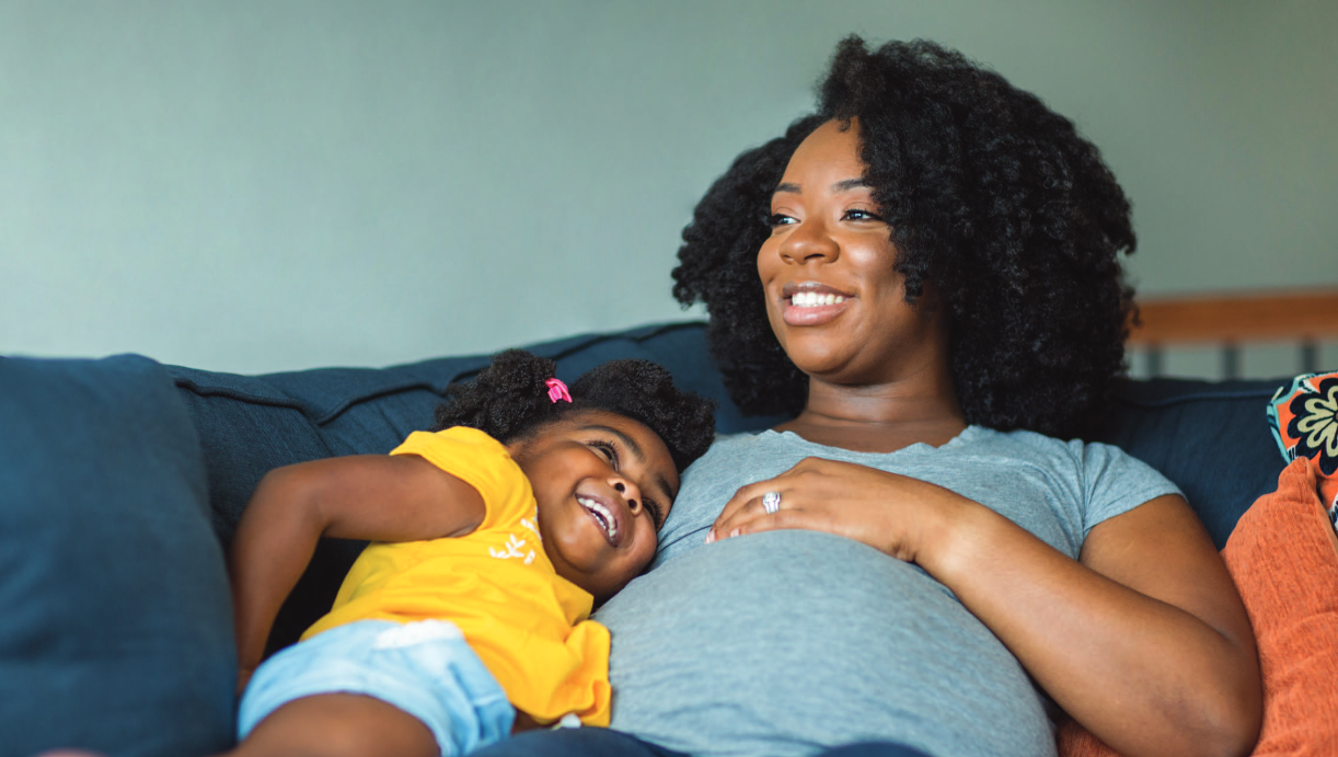 mother and child laying down smiling