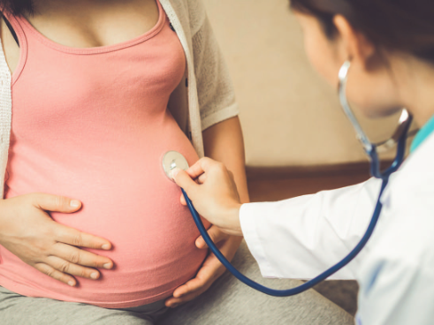 Promoting Healthy Births (Healthy) doctor checking pregnant woman